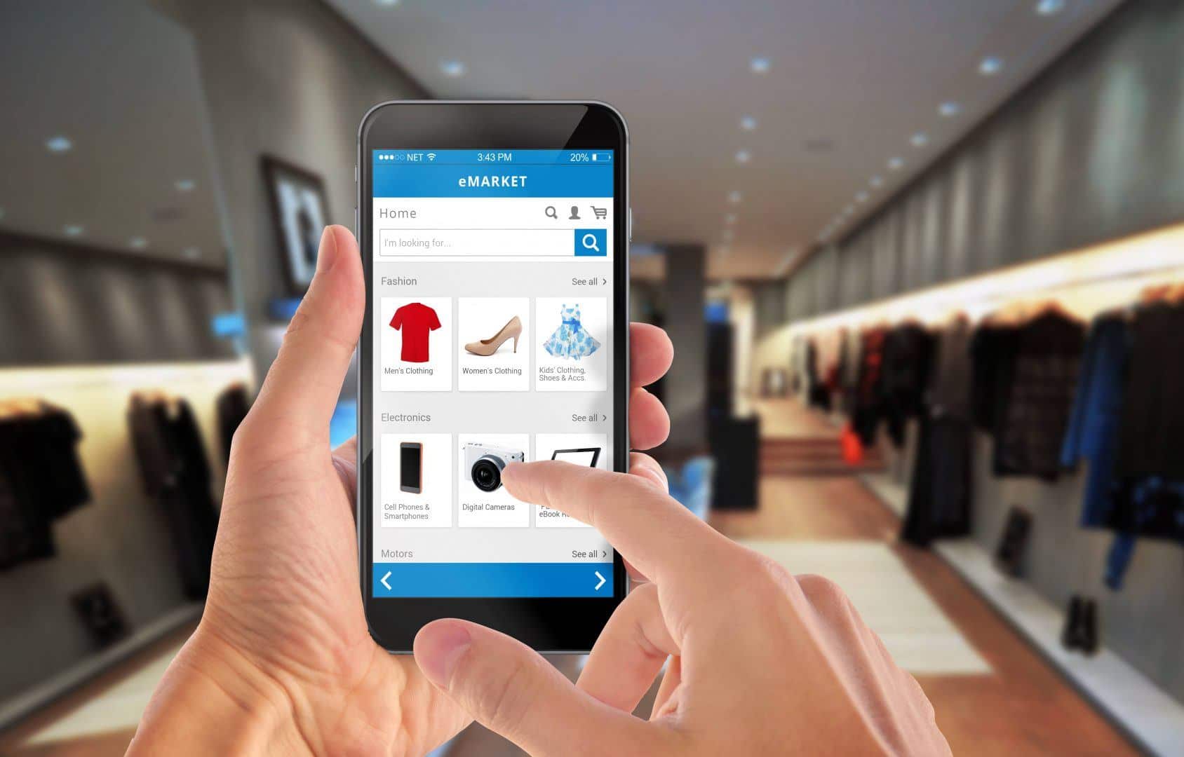 Smart phone online shopping in man hand. Shopping center in background.